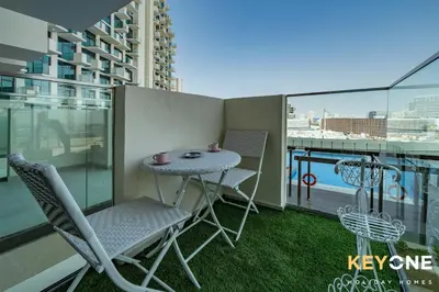 a balcony with a table and chairs on a balcony at Farhad Exclusive Studio Suite in Dubai