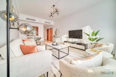a living room with white furniture and a flat screen tv at Opulent 1BR at MAG 218 Dubai Marina by Deluxe Holiday Homes in Dubai