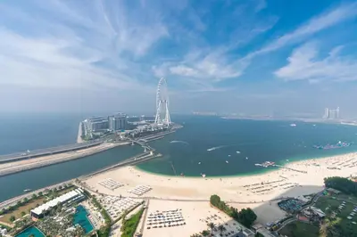 an aerial view of a beach and a ferris wheel at Lux BnB I The Address JBR I Ocean View in Dubai