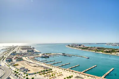 an aerial view of a harbor with boats in the water at Splendid 2BR at Sunrise Bay Tower 1 Emaar Beachfront Dubai Marina by Deluxe Holiday Homes in Dubai