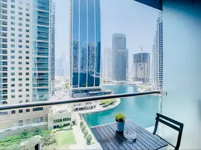 a view of a city skyline from a balcony at Luxury Modern Studio in JLT - Rooftop Pool - Lake Area Upgrades Ongoing in Dubai