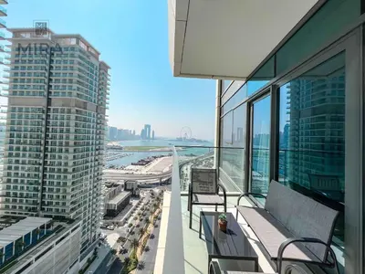 a balcony of a building with a view of a city at Mira Holiday Homes - Newly 1 bedroom apartment with beach access in Dubai