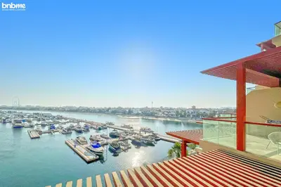 a view of a marina with boats in the water at bnbme - Palm Jumeirah Studio Balcony Sea Ain Dubai Views Pool Gym Parking Access in Dubai