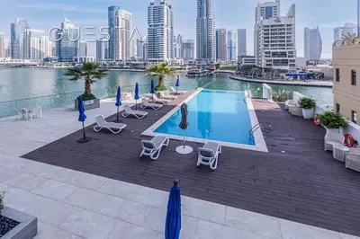 a swimming pool on the roof of a building at LIV Residence Tower, Dubai Marina in Dubai