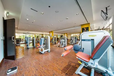 a gym with cardio equipment in a building at EDEN'S Homes & Villas - Anantara The Palm Residences in Dubai