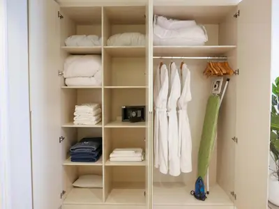 a white closet with white towels and towels at Lovely 1 bedroom apartment at 5 Star Resort in Dubai