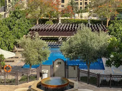 an overhead view of a swimming pool with a fountain at Durrani Homes - Souk Al Bahar Living Besides Burj khalifa & Fountain in Dubai