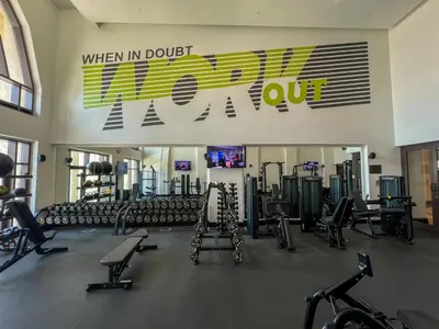 a gym with a bunch of exercise equipment in it at Durrani Homes - Souk Al Bahar Living Besides Burj khalifa & Fountain in Dubai