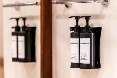 a group of three bottles of soap on a shelf at Fairmont The Palm Residences I Access to Hotel Facilities in Dubai