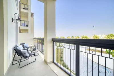 a balcony with chairs and a view of the ocean at Placid 1BR at La Cote 5 Jumeirah 1 by Deluxe Holiday Homes in Dubai