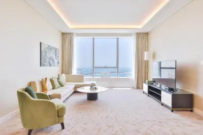 a living room with a couch and a table at Ultra Luxury Palm Tower with Shared Hotel Facilities in Dubai