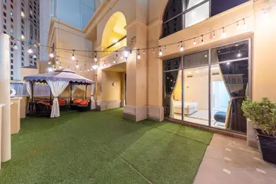 a room with a green floor in a building at ELAN RIMAL SADAF Suites in Dubai
