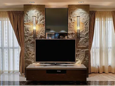 a living room with a flat screen tv on a table at ELAN RIMAL SADAF Suites in Dubai