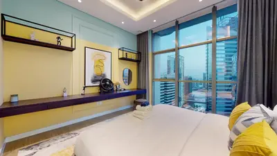 a bedroom with a white bed and a large window at High-End Designer Penthouse Full Burj Khalifa View in Dubai