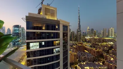 a view of a city skyline with a tall building at High-End Designer Penthouse Full Burj Khalifa View in Dubai