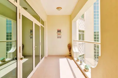 a hallway of a building with glass doors at Luxury Beachfront Palm Jumeirah I Free 5 Star Beach Resorts Access in Dubai