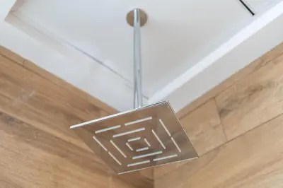 a metal light hanging from a ceiling at Tropical Loft with working station in JVC in Dubai