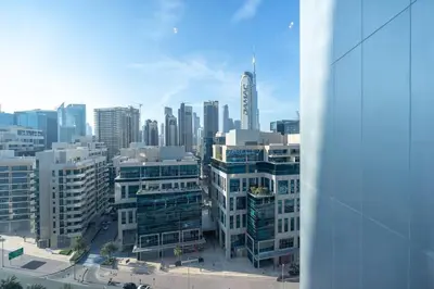 a view of a city skyline with tall buildings at Cosmopolitan Apartment with Burj Khalifa View in Dubai