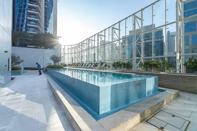 a swimming pool in the middle of a building at Cosmopolitan Apartment with Burj Khalifa View in Dubai
