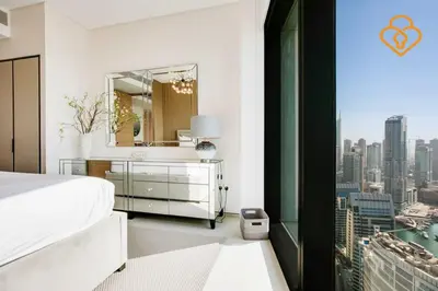 a bedroom with a white bed and a mirror at Keysplease Luxury 1 BR Apt Address W Private Beach, JBR in Dubai