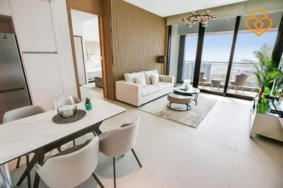 a living room with a couch and a table and chairs at Keysplease Luxury 1 BR Apt Address W Private Beach, JBR in Dubai