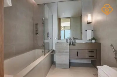 a bathroom with a tub and a shower and a sink at Keysplease Luxury 1 BR Apt Address W Private Beach, JBR in Dubai