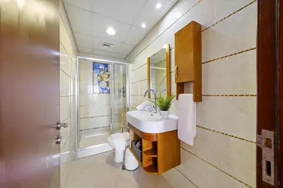 a bathroom with a sink and a shower and a toilet at 2BR in JBR / Sea View / Dubai Marina / Walk2Beach in Dubai