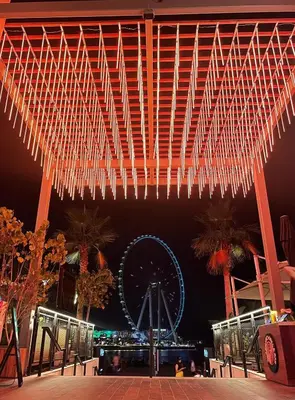 a large structure with a ferris wheel in the background at Al Bateen · Ultra Luxury JBR · Private Beach and Pool in Dubai