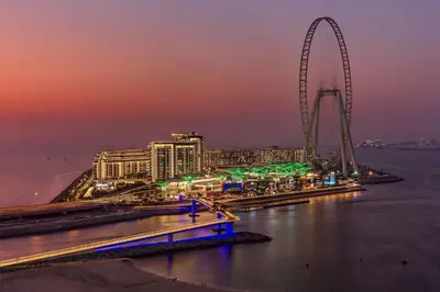 a view of a city with a ferris wheel at night at Al Bateen · Ultra Luxury JBR · Private Beach and Pool in Dubai
