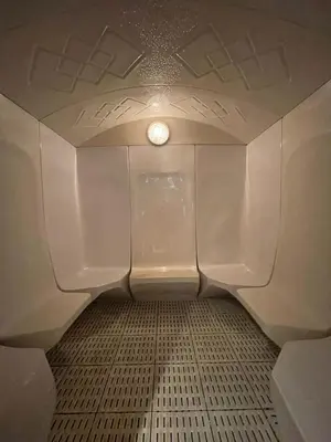 a bathroom with a toilet with a light in it at DA84 - Chic Studio in Dubai Arch Tower in Dubai