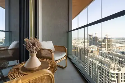 a balcony with a table and a vase on it at Frank Porter - One Park Avenue in Dubai