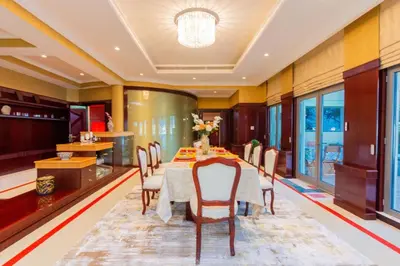 a dining room with a table and chairs at Orion in Dubai