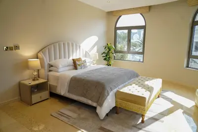 a bedroom with a large bed and a window at Orion in Dubai