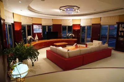 a living room with a couch and a table at Orion in Dubai