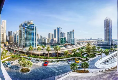 a view of a city with palm trees and buildings at Spacious 1BD apartment in Address Beach Residence in Dubai