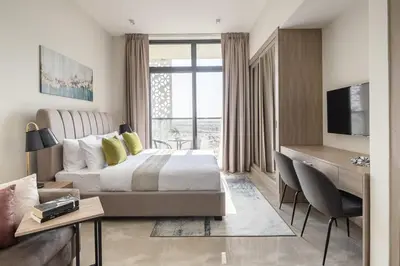 a hotel room with a bed and a desk and a desk at Frank Porter - Majestique 1 in Dubai