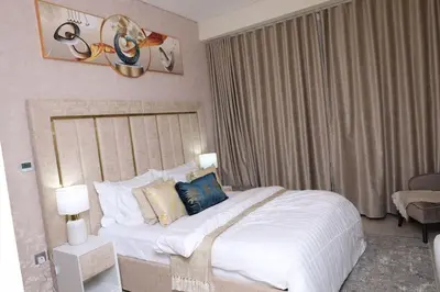 a bedroom with a large bed in a hotel room at Superb Studio by The Creek view in Dubai