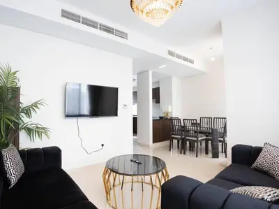 a living room with a couch and a table at Corner 3Bedroom Townhouse in Avencia Cluster DH2 in Dubai