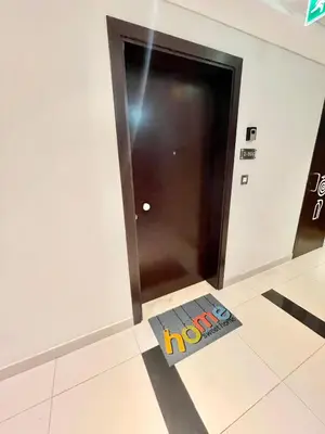 a sign on the floor in front of a door at Super Elegant studio apartment-Sparkle tower By SWEET HOMES in Dubai