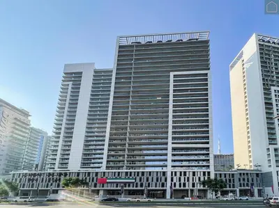 a large building in a city with tall buildings at ONYX - Full Burj Khalifa View Dubai 2 BEDROOM APARTMENT - DOWNTOWN DUBAI in Dubai