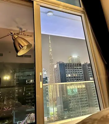 a window with a view of a city skyline at ONYX - Full Burj Khalifa View Dubai 2 BEDROOM APARTMENT - DOWNTOWN DUBAI in Dubai