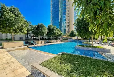 a swimming pool in the middle of a building at Stylish 2-Bed Apt Burj Khalifa and Fountain Views in Dubai