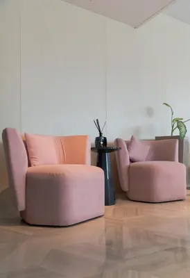 two pink chairs sitting in a living room at EDEN'S Homes & Villas - FIVE Palm Residences Penthouses in Dubai