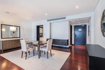 a dining room with a table and chairs at Marvelous private beach apartment in Palm Dubai within Anantara 5 star resort in Dubai