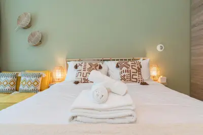 a bedroom with a bed with towels on it at Stunning Apt Marina view with Balcony in Dubai