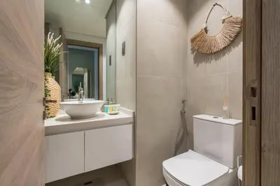 a bathroom with a toilet and a sink and a mirror at Stunning Apt Marina view with Balcony in Dubai