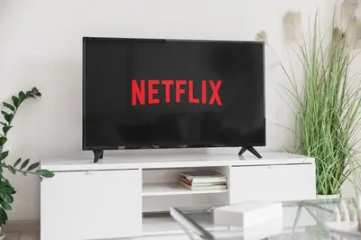 a television on a tv stand in a living room at Charming 1BR in The Greens, Near Metro in Dubai