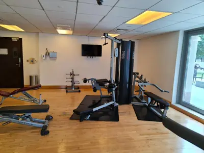a gym with treadmills and cardio machines in a room at Marco Polo - Wake up to breathtaking Burj Khalifa views in Dubai
