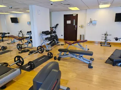 a gym with a bunch of exercise bikes in a room at Marco Polo - Wake up to breathtaking Burj Khalifa views in Dubai