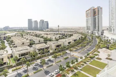 an aerial view of a city street with buildings at Tranquil 1BR apartment in Carson C, Damac Hills - Allsopp&Allsopp in Dubai